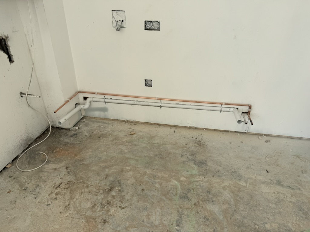 New copper and waste pipework installed during a kitchen renovation